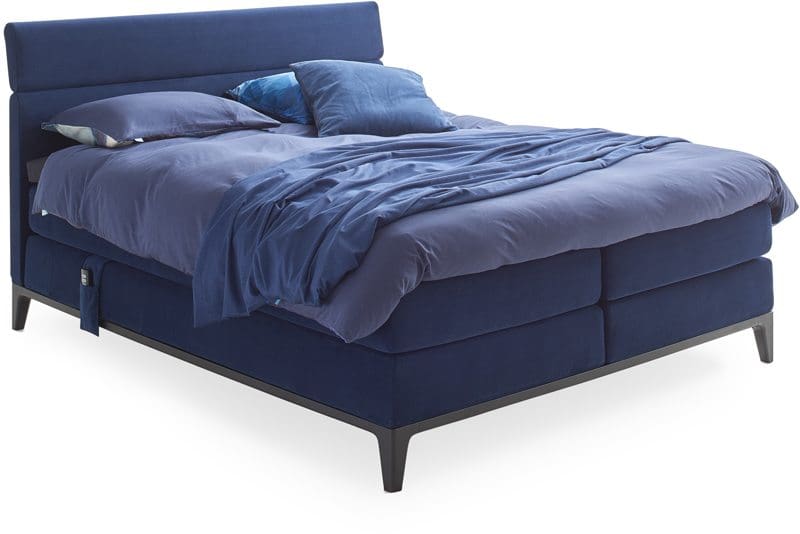 Boxspring Criade van Auping, afgebeeld met hoofdbord Bend, stel uw bed naar wens samen!